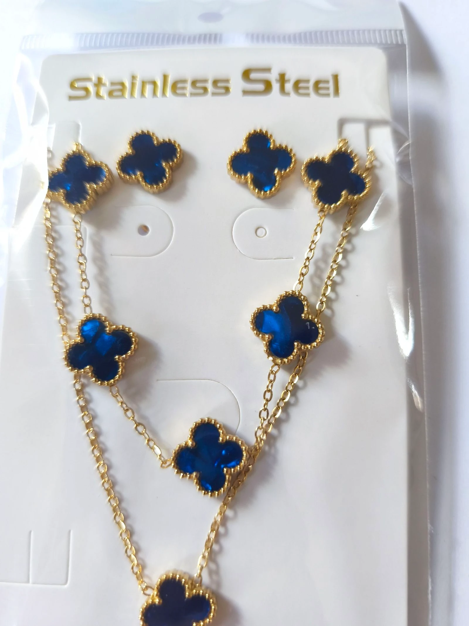 Set de gargantilla pulsera y pendientes de trebol azul iluminado con cadena dorada inalterable